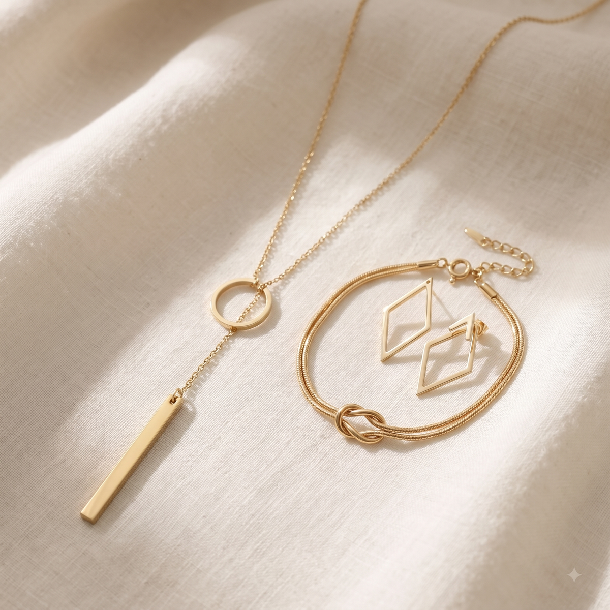The Everyday Gold Set - gold lariat necklace, gold knot bracelet and geometric gold earrings together